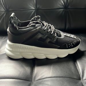 Brand new, never worn black Versace chain reaction shoes